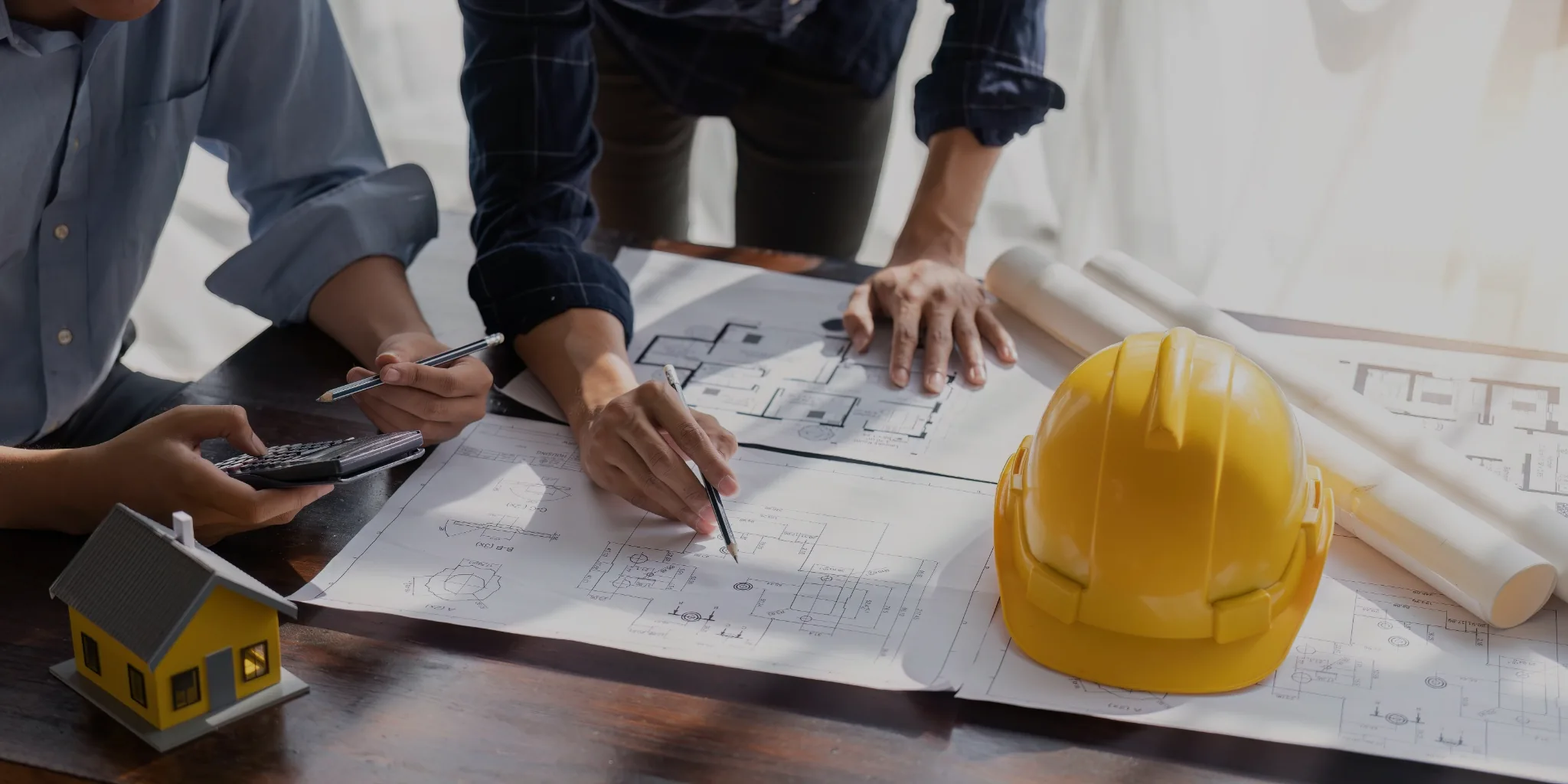 Engineer team planning design house, modifying plan, creating construction plan